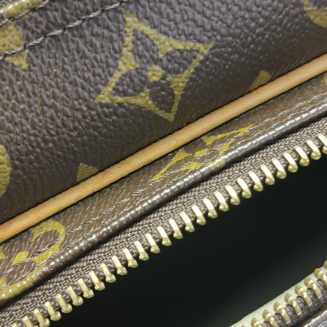 REPORTER PM Monogram Coated Canvas Brown