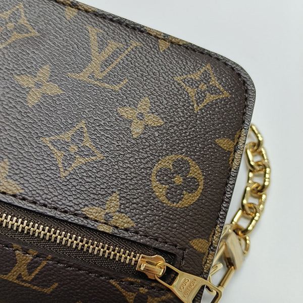 MÉTIS EAST WEST Monogram Coated Canvas Brown