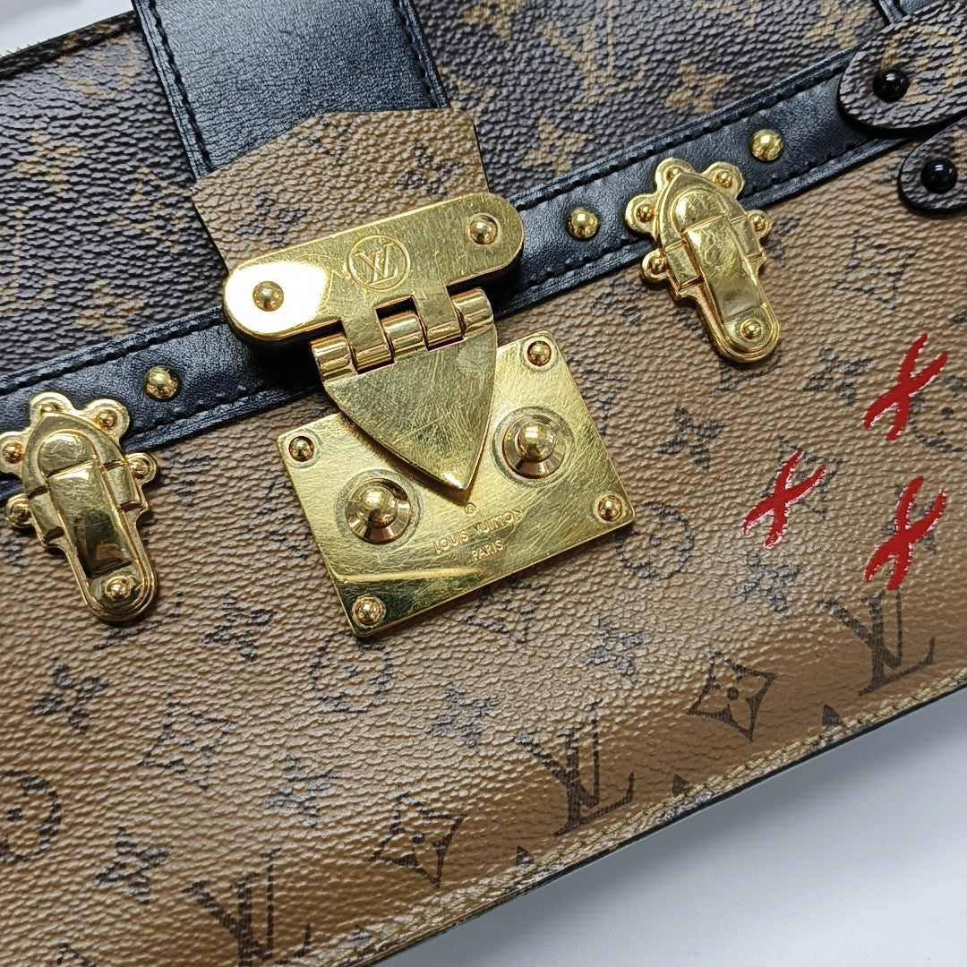 TRUNK Monogram Coated Canvas Brown