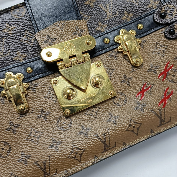 TRUNK Monogram Coated Canvas Brown