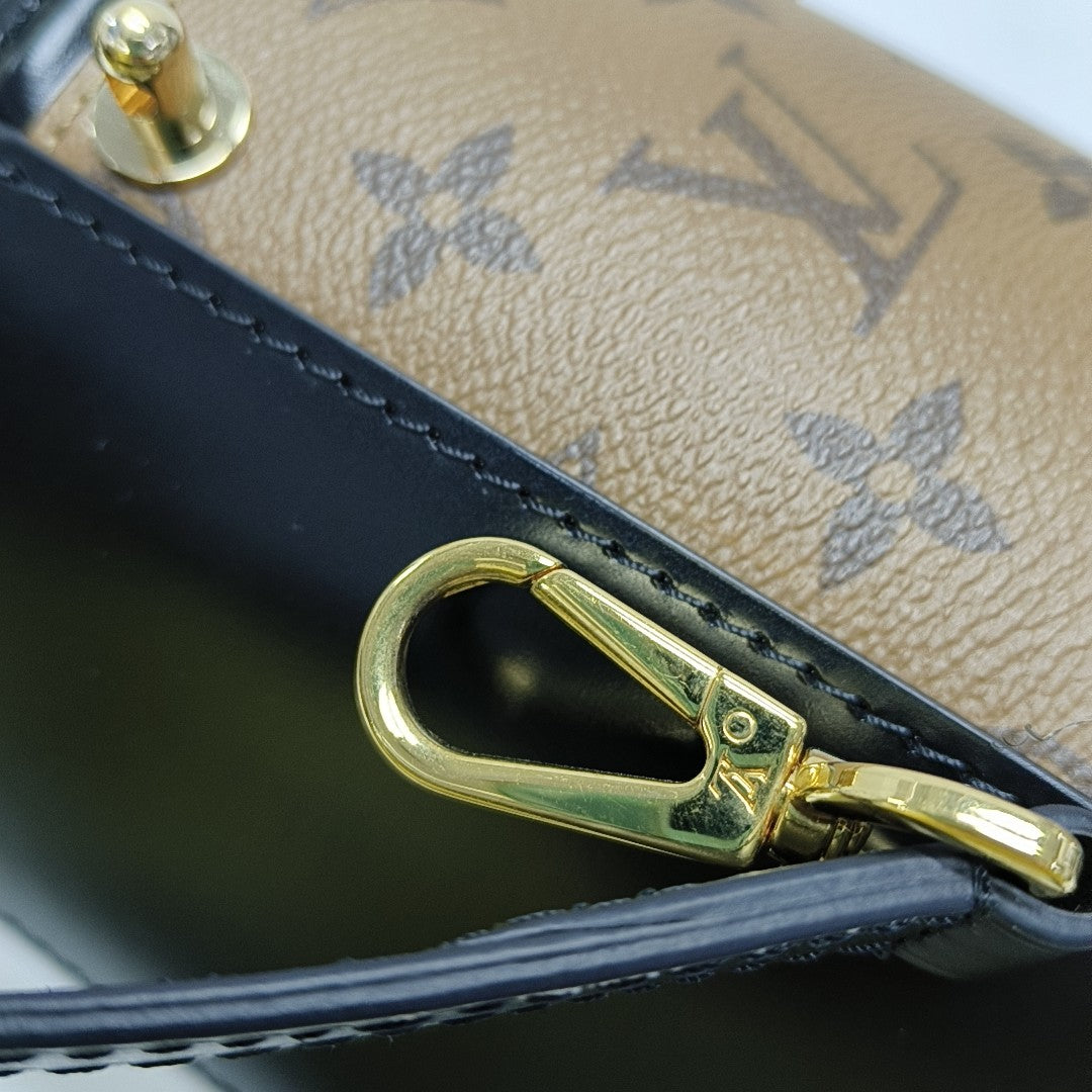 CANNES PM Monogram Coated Canvas Brown
