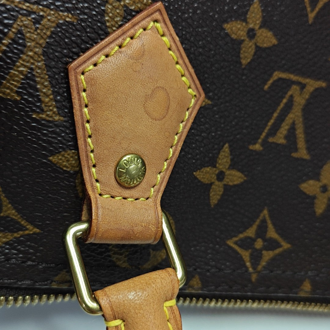 SPEEDY 25 Monogram Coated Canvas Brown