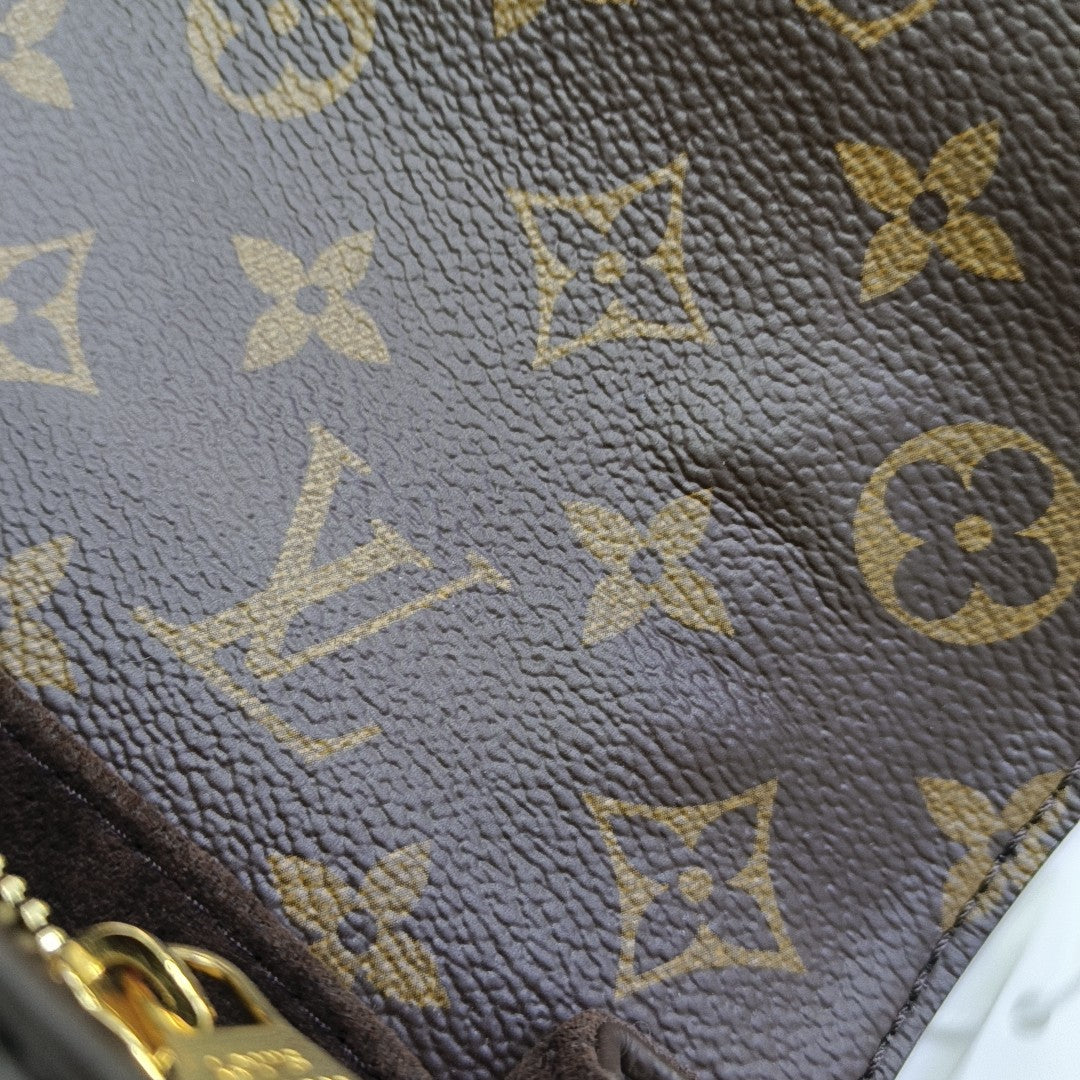 MÉTIS EAST WEST Monogram Coated Canvas Brown