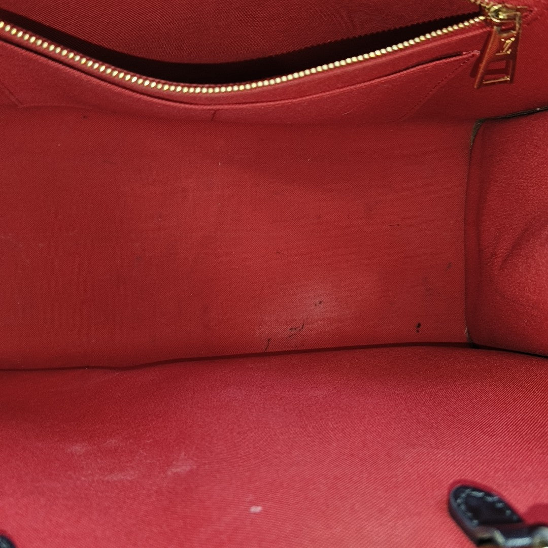ONTHEGO MM Monogram Coated Canvas Brown