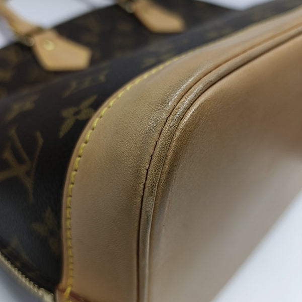 ALMA PM Monogram Coated Canvas Brown