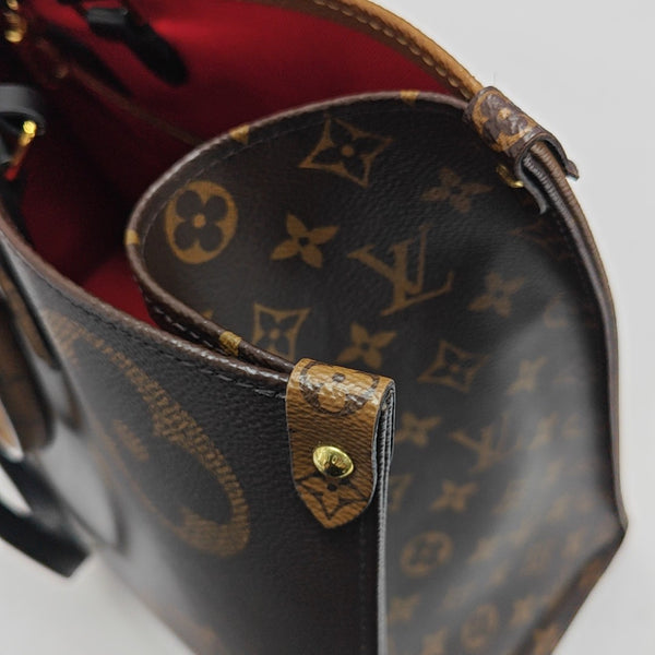 ONTHEGO GM Monogram Coated Canvas Brown