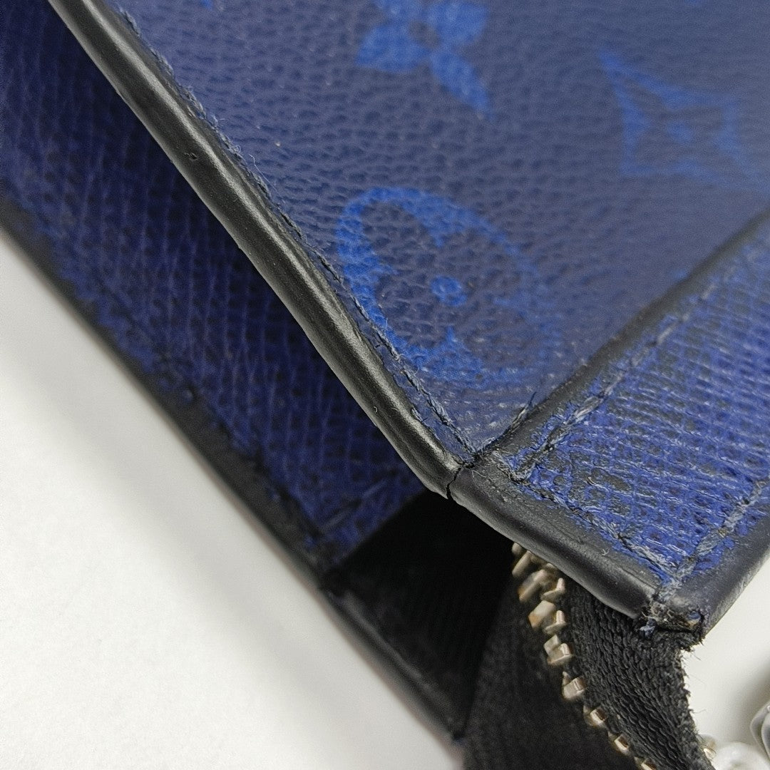 Pochette Voyag MM Monogram Coated Canvas Blue