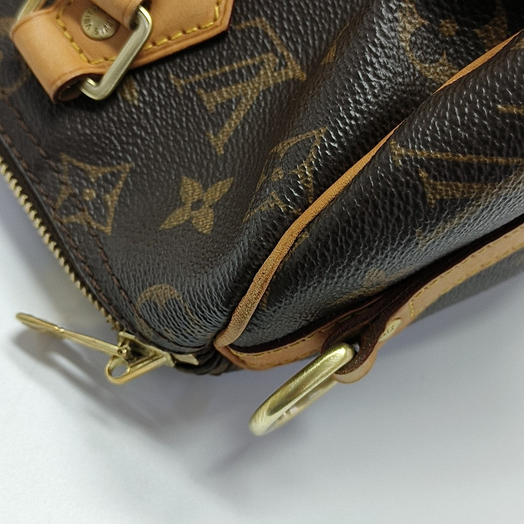 SPEEDY 25 Monogram Coated Canvas Brown