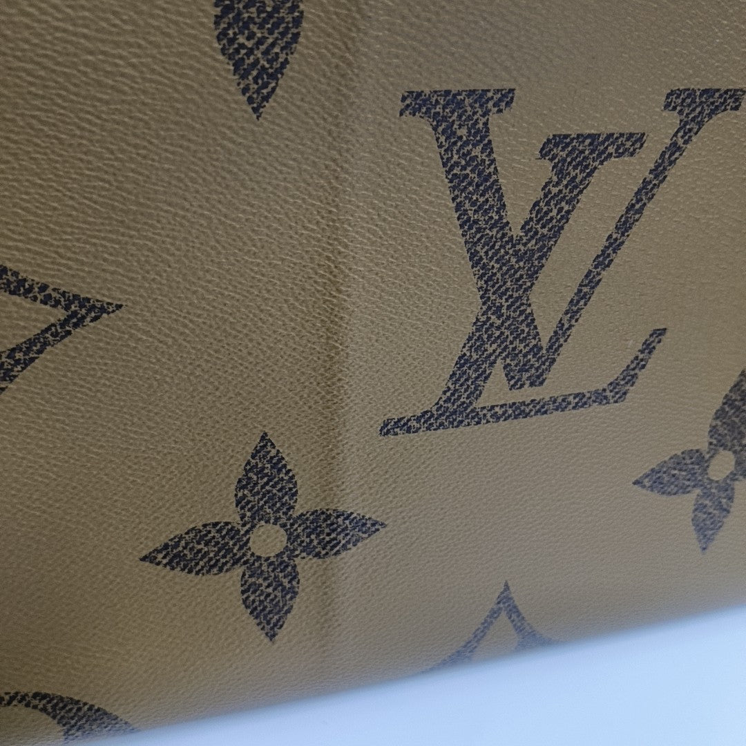 ONTHEGO GM Monogram Coated Canvas Brown