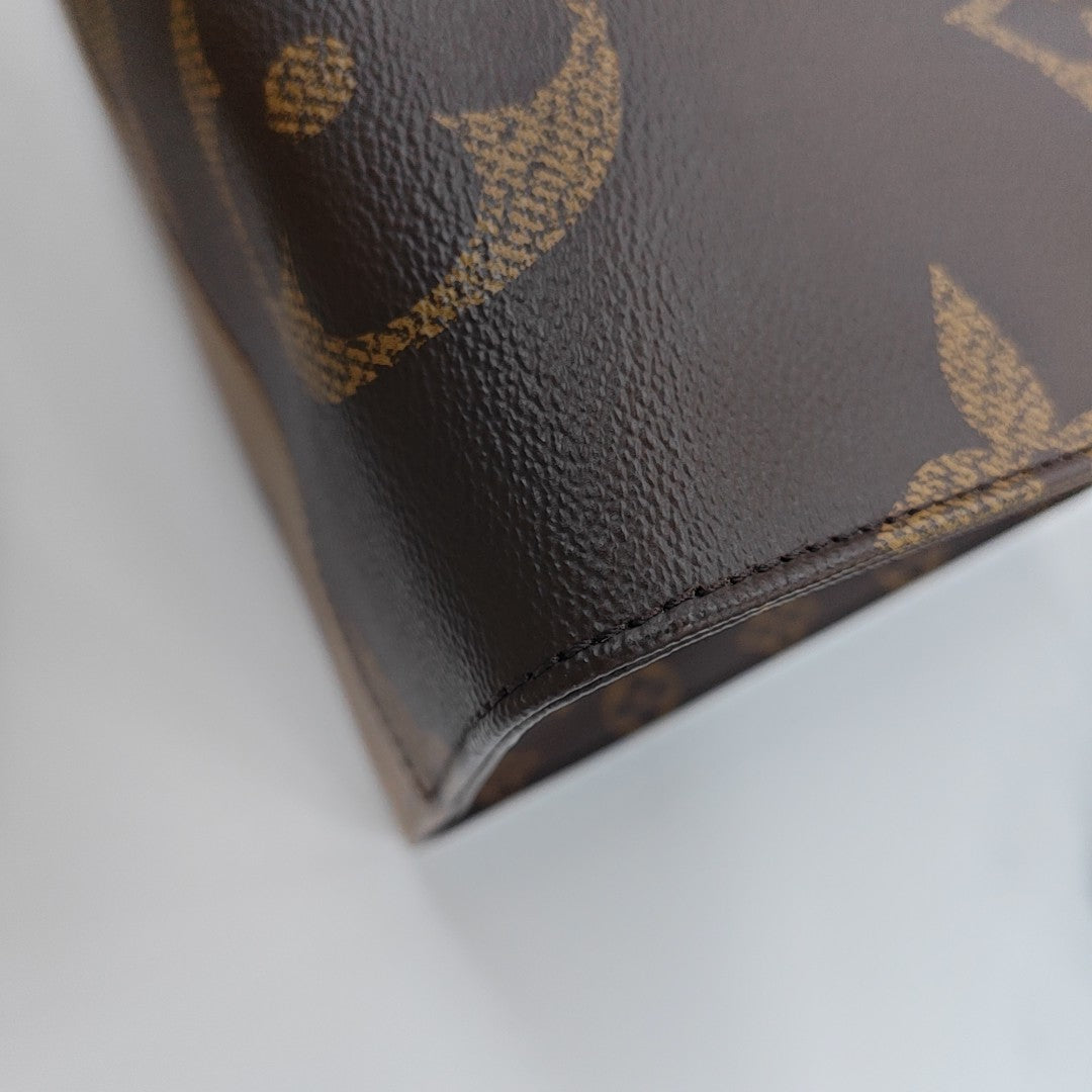 ONTHEGO GM Monogram Coated Canvas Brown