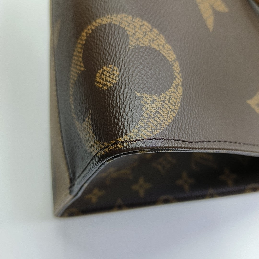 ONTHEGO MM Monogram Coated Canvas Brown