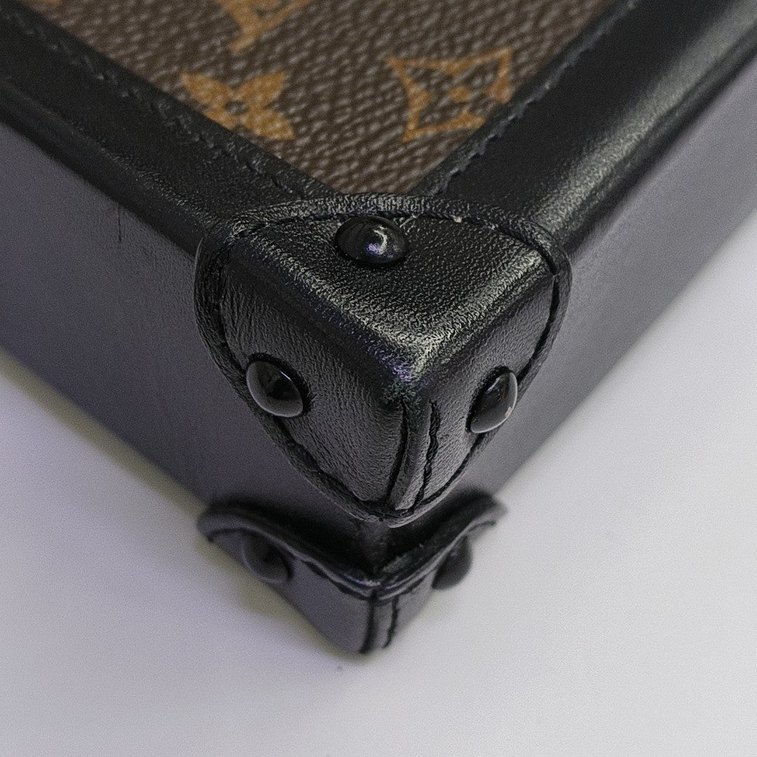 TRUNK Monogram Coated Canvas Brown
