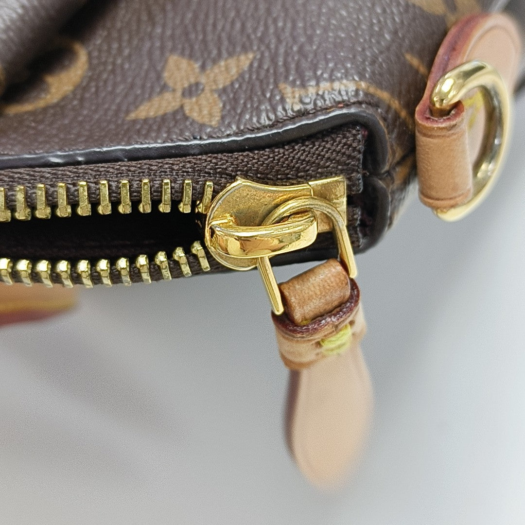 RIVOLI BB Monogram Coated Canvas Brown