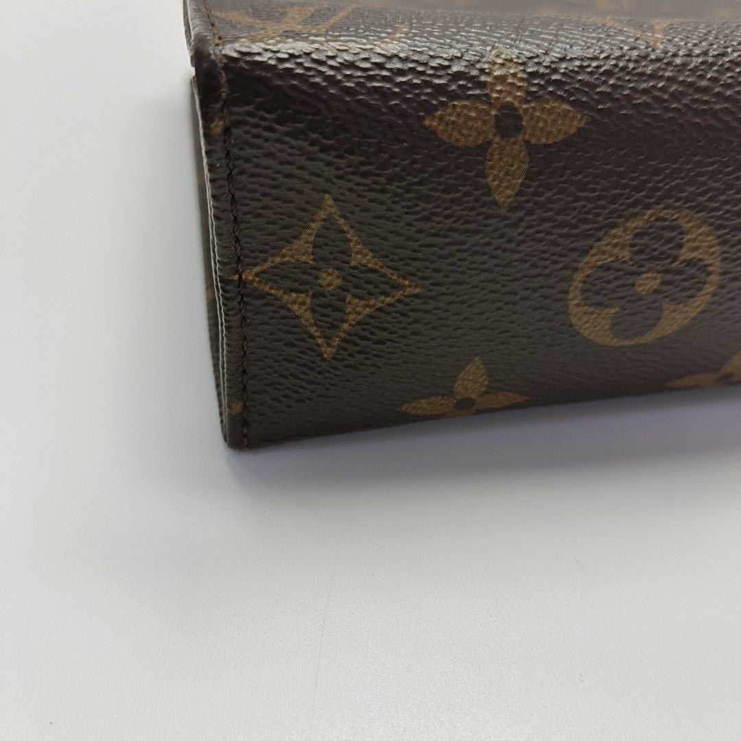 TOILET POCKET 19 Monogram Coated Canvas Brown