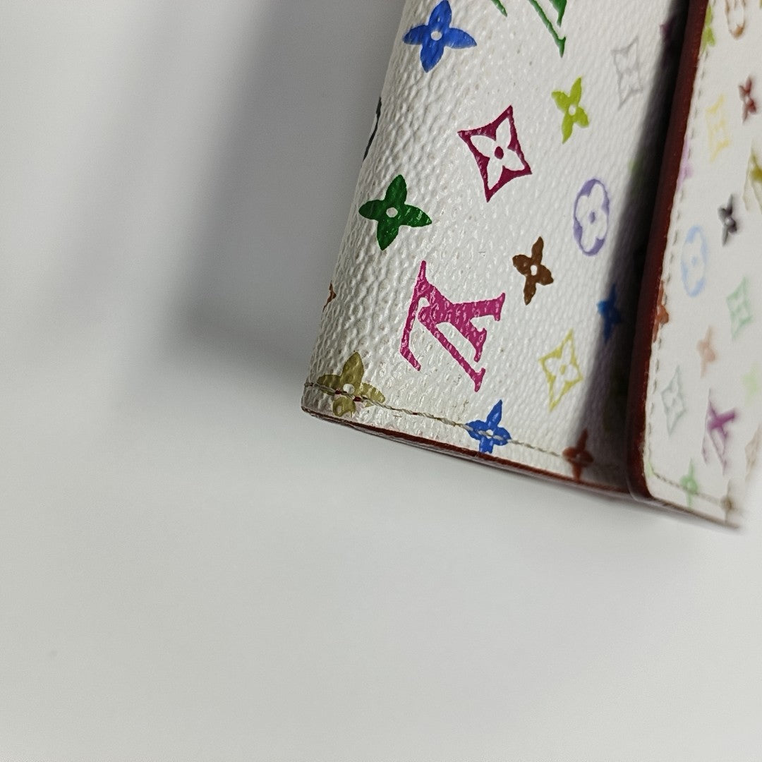 Monedero Monogram en lona revestida blanca
