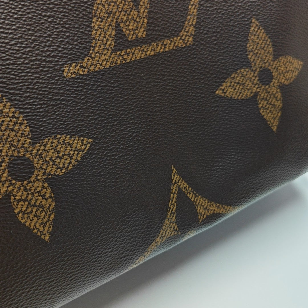 ONTHEGO MM Monogram Coated Canvas Brown