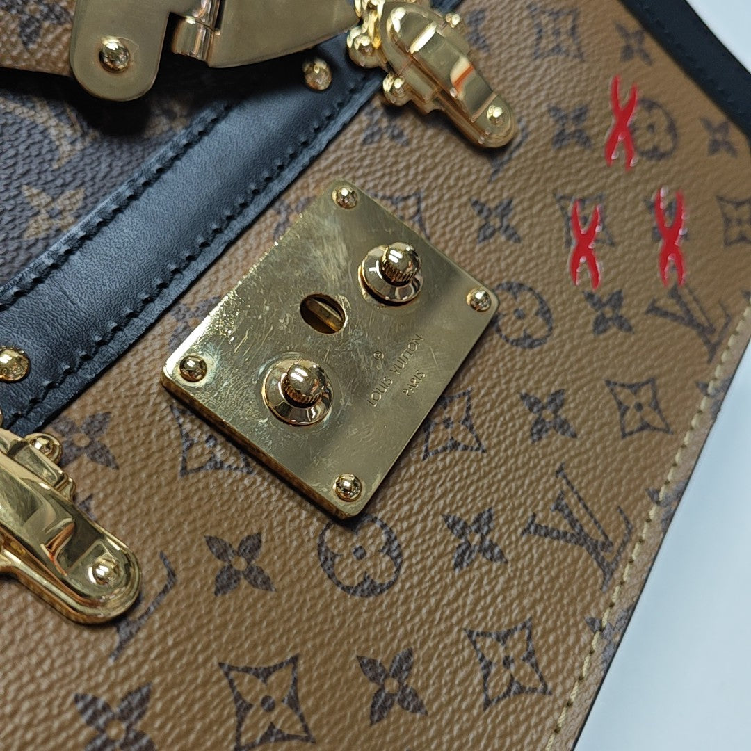 TRUNK Monogram Coated Canvas Brown