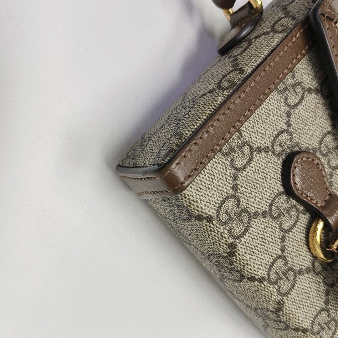 Authenticated pre-owned  Horsebit 1955 Mini Monogram Coated Canvas Beige - Shoulder Bag at Looply