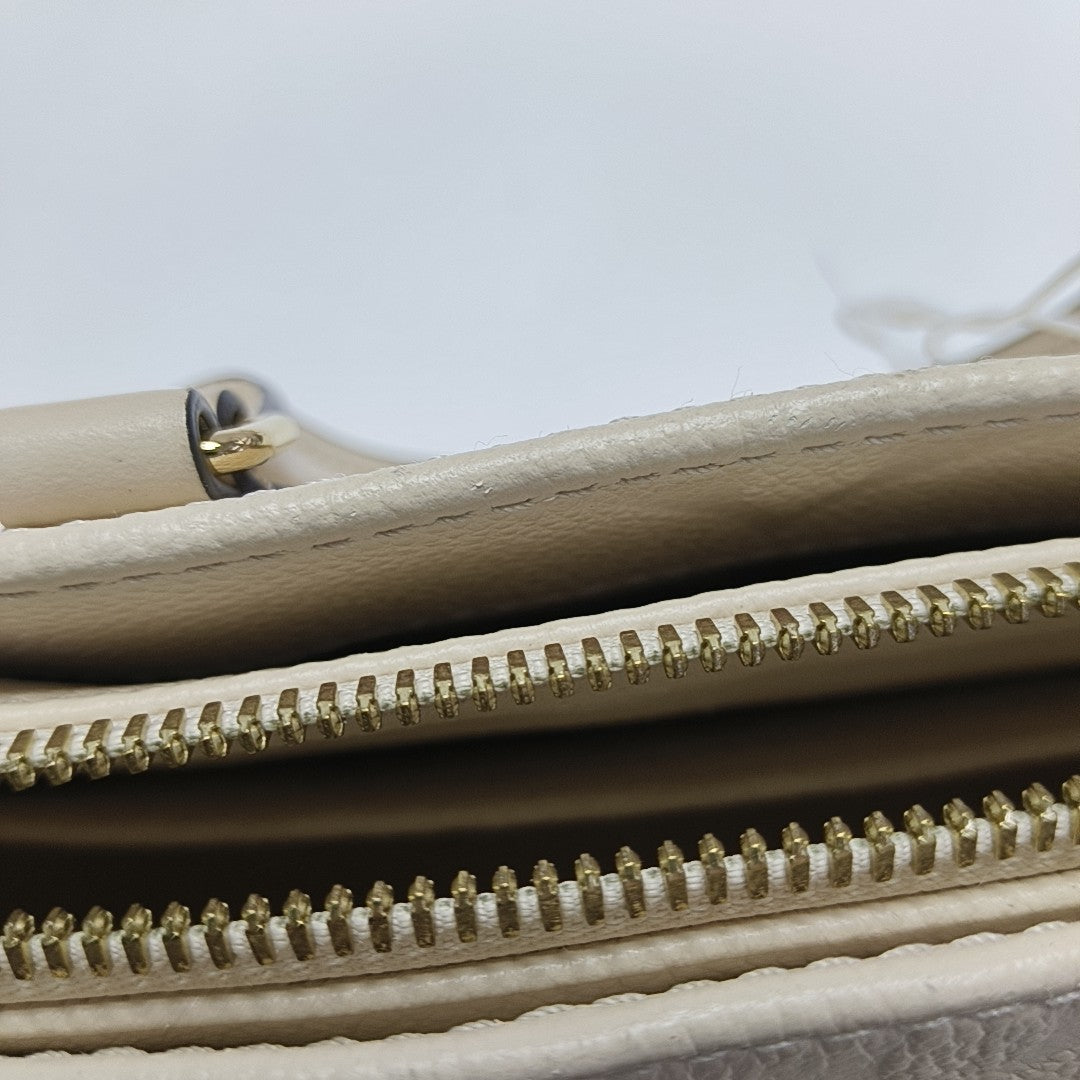 ONTHEGO EAST WEST PM Monogram Calfskin White
