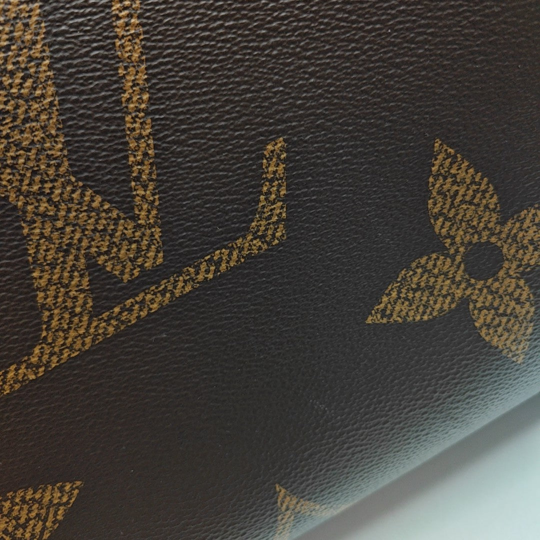 ONTHEGO MM Monogram Coated Canvas Brown