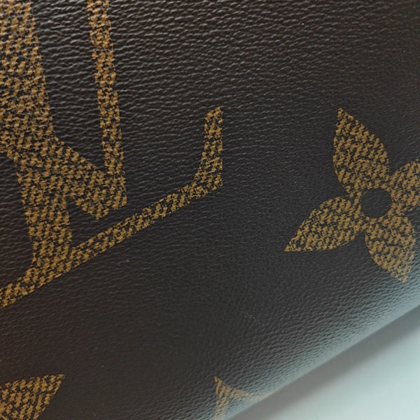 ONTHEGO MM Monogram Coated Canvas Brown
