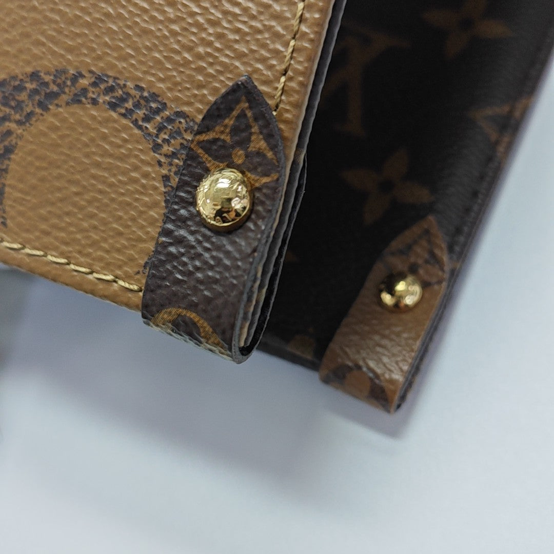 ONTHEGO MM Monogram Coated Canvas Brown