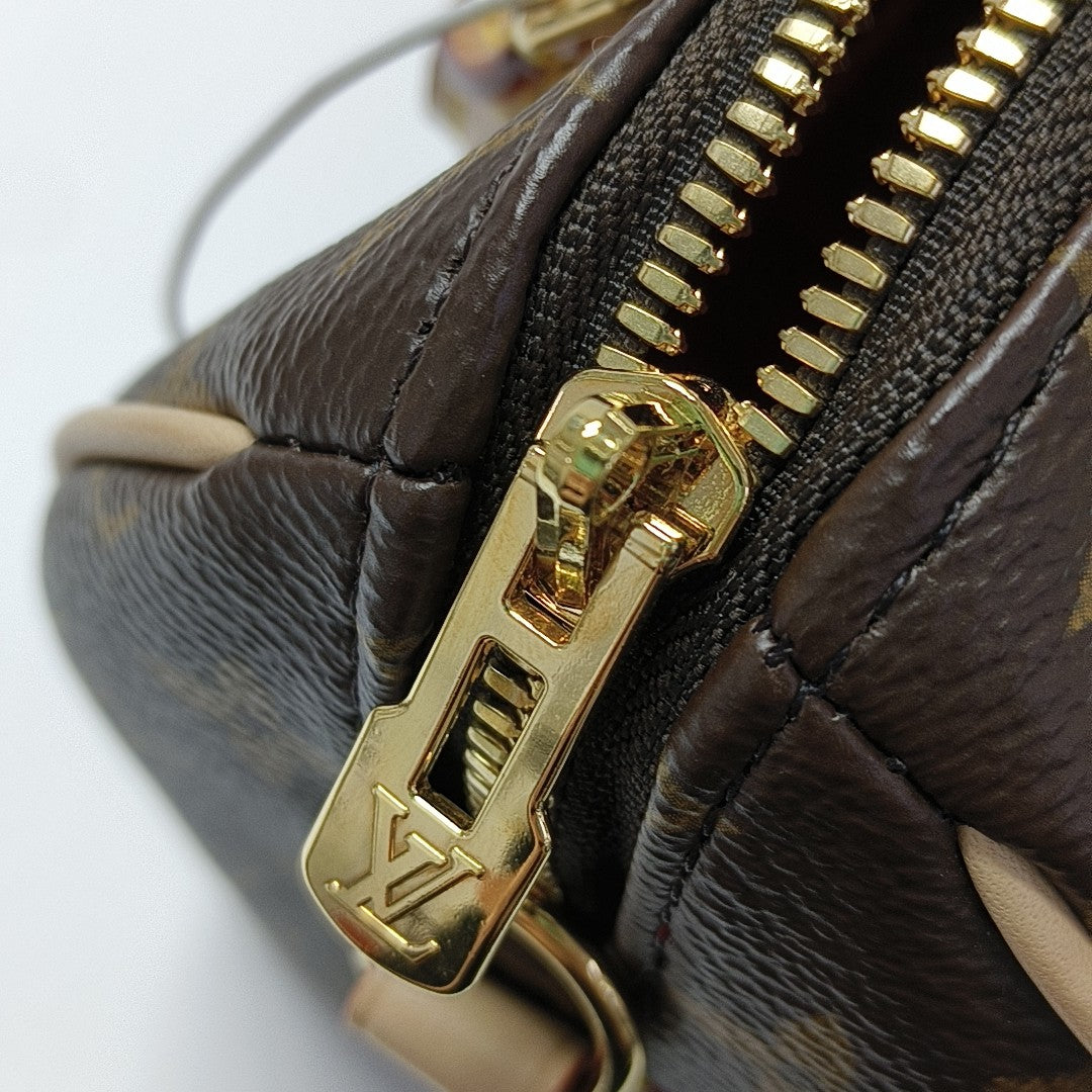 SPEEDY 20 Monogram Coated Canvas Brown