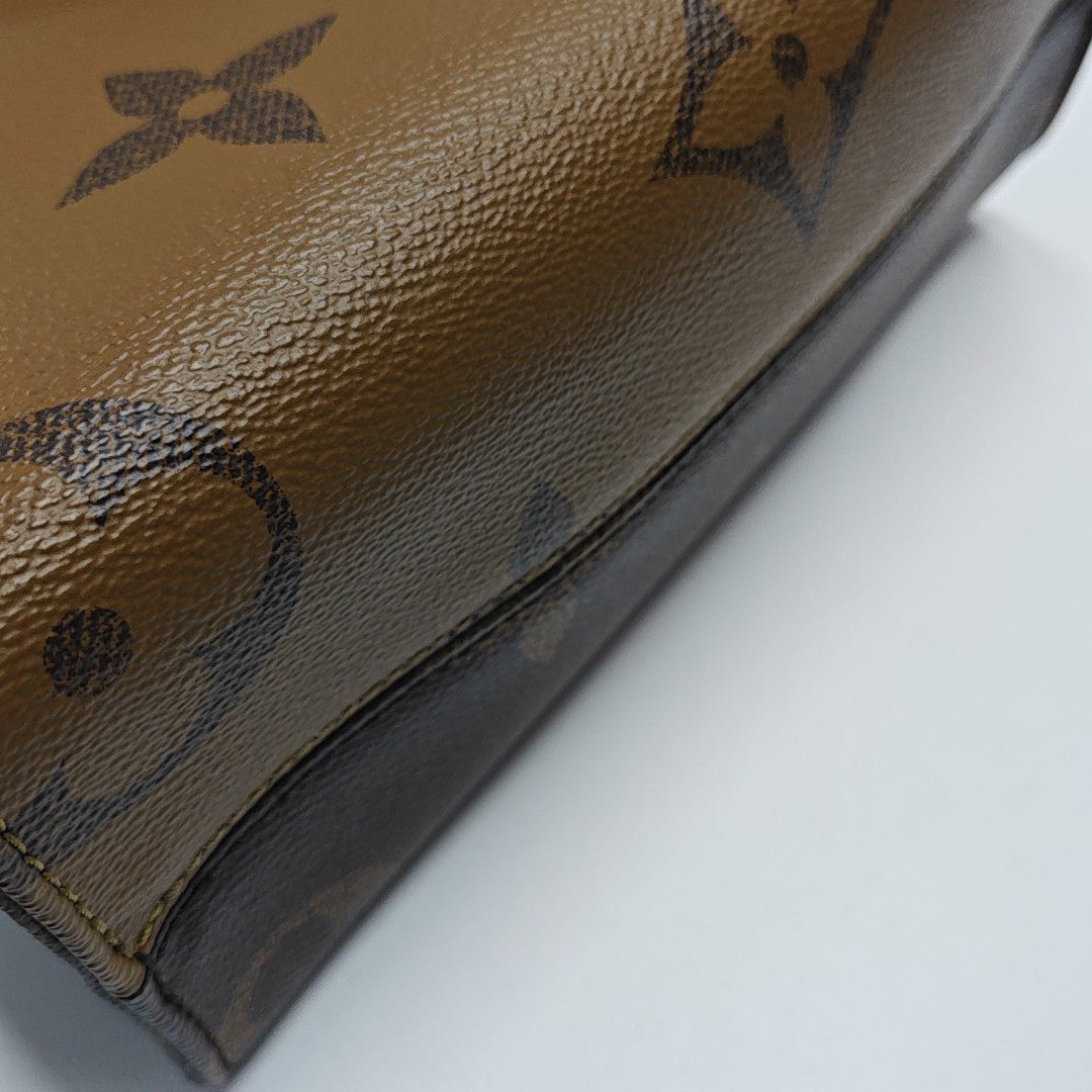 ONTHEGO PM Monogram Coated Canvas Brown