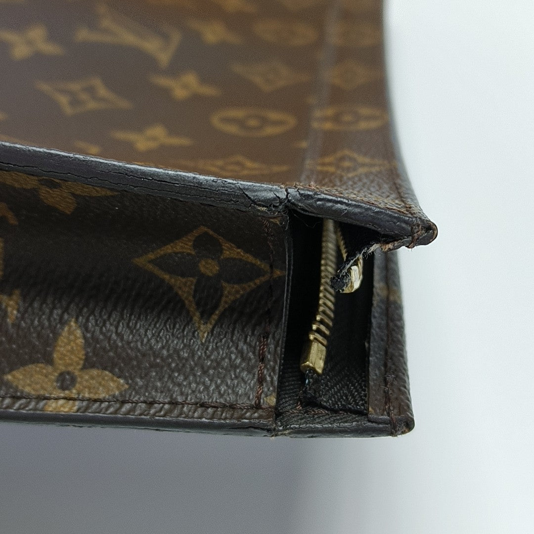 Pochette Voyag MM Monogram Coated Canvas Blue