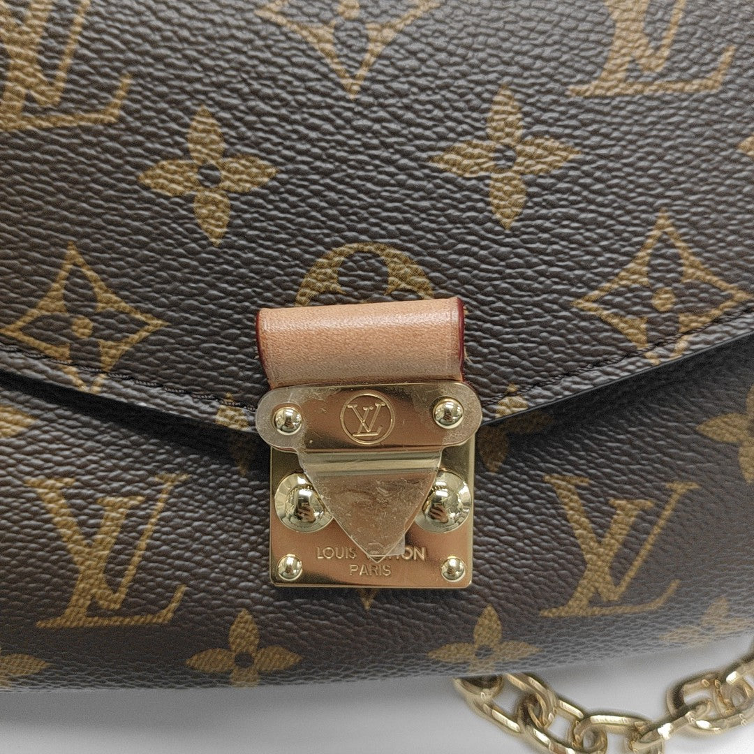MÉTIS EAST WEST Monogram Coated Canvas Brown