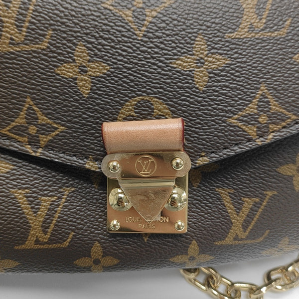 MÉTIS EAST WEST Monogram Coated Canvas Brown