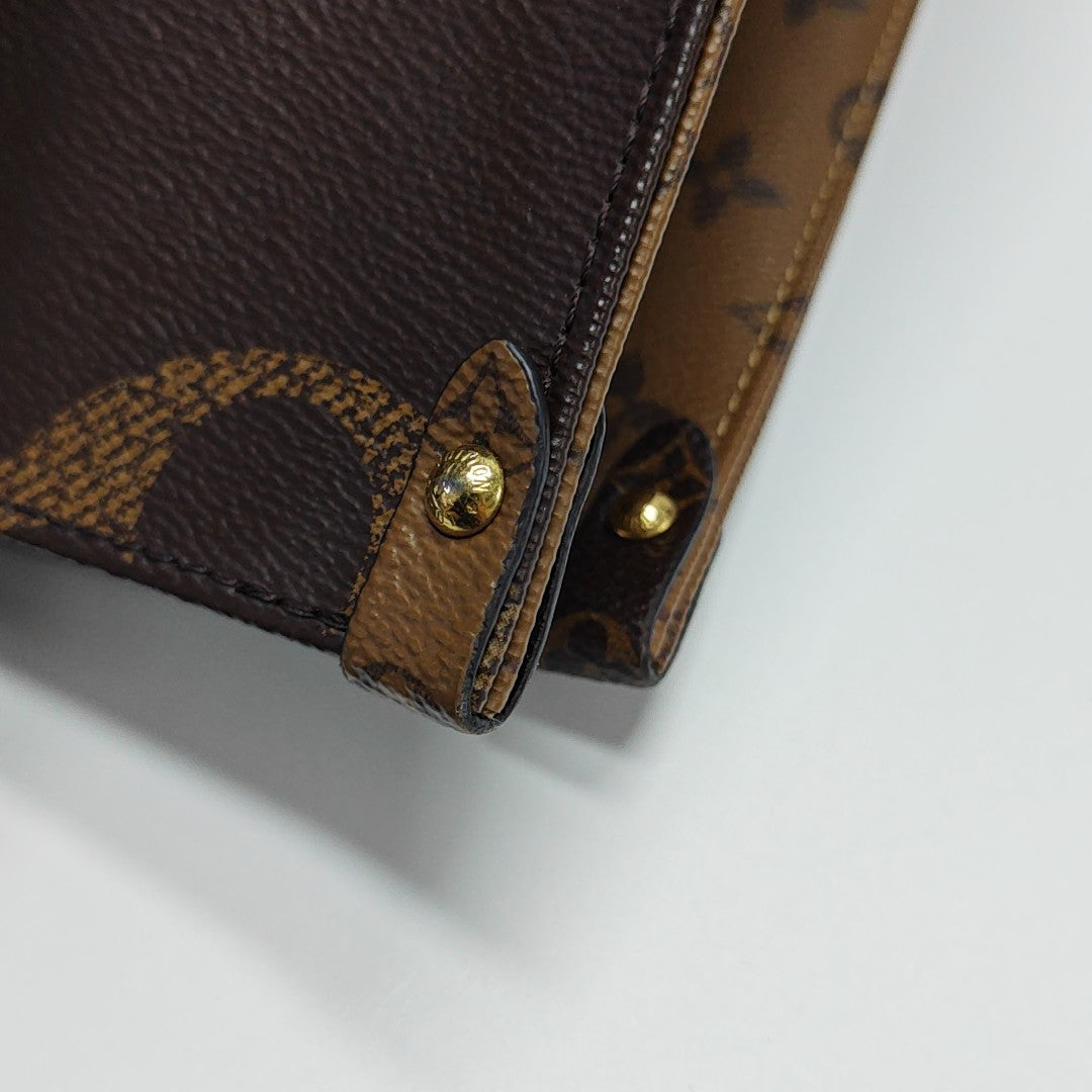 ONTHEGO MM Monogram Coated Canvas Brown