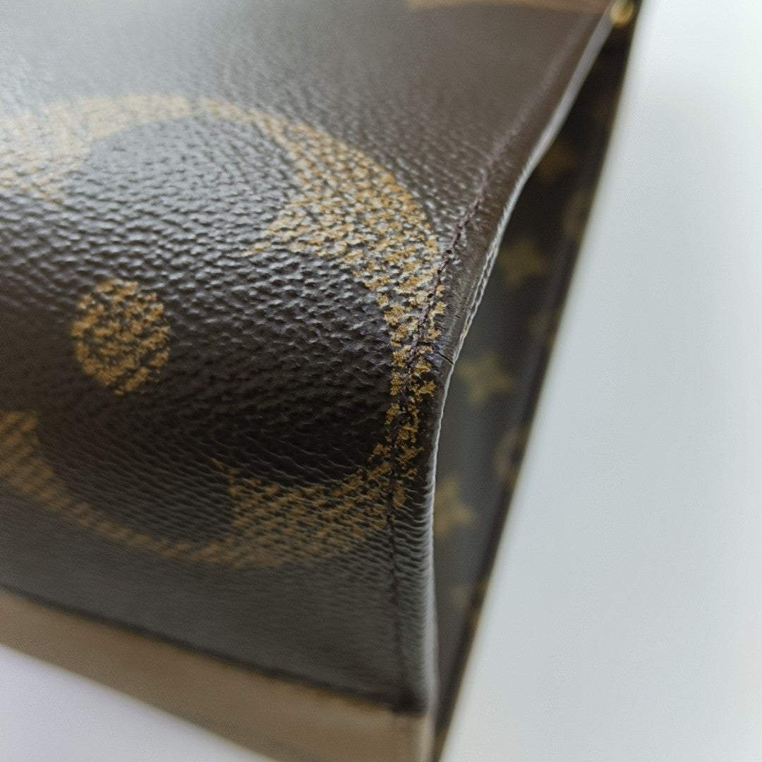 ONTHEGO MM Monogram Coated Canvas Brown