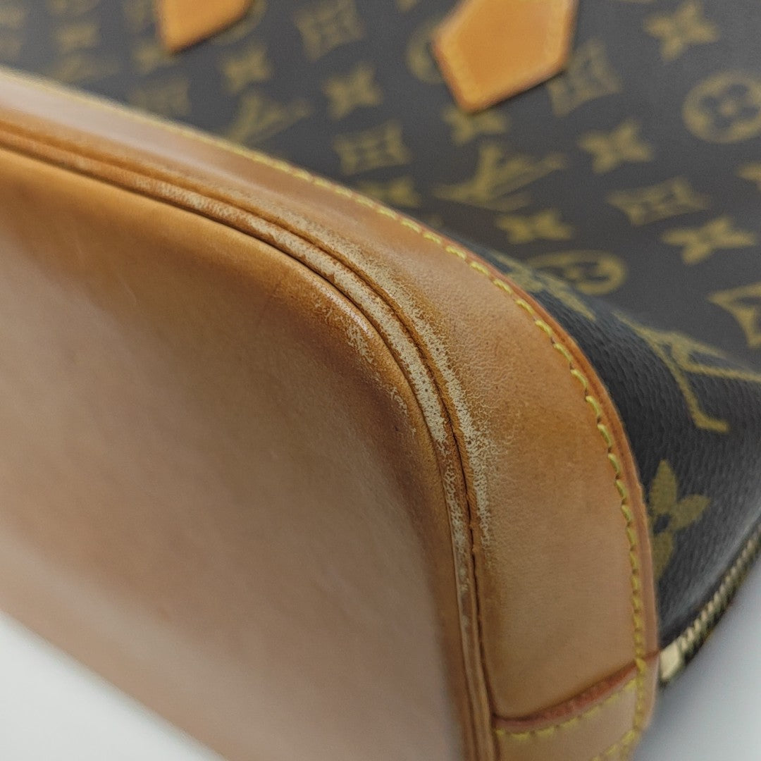 ALMA PM Monogram Coated Canvas Brown