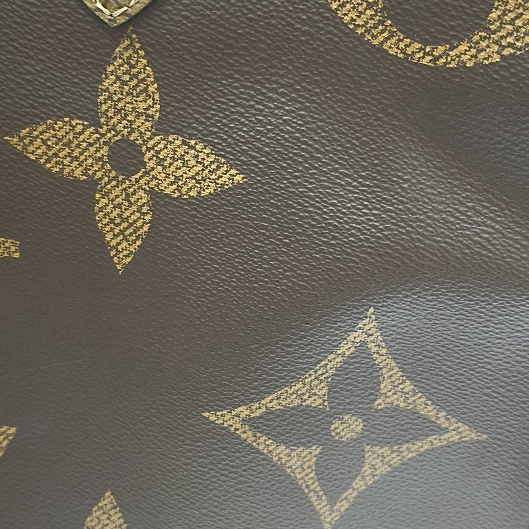 ONTHEGO GM Monogram Coated Canvas Brown