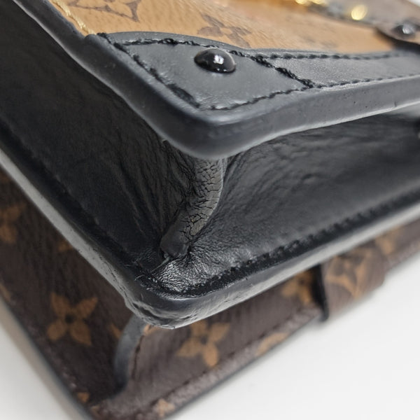 TRUNK Monogram Coated Canvas Brown