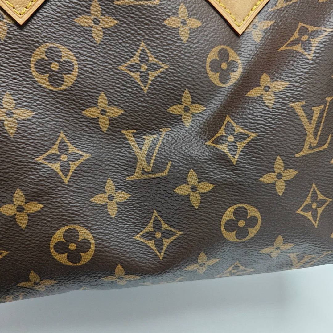 SPEEDY 25 Monogram Coated Canvas Brown