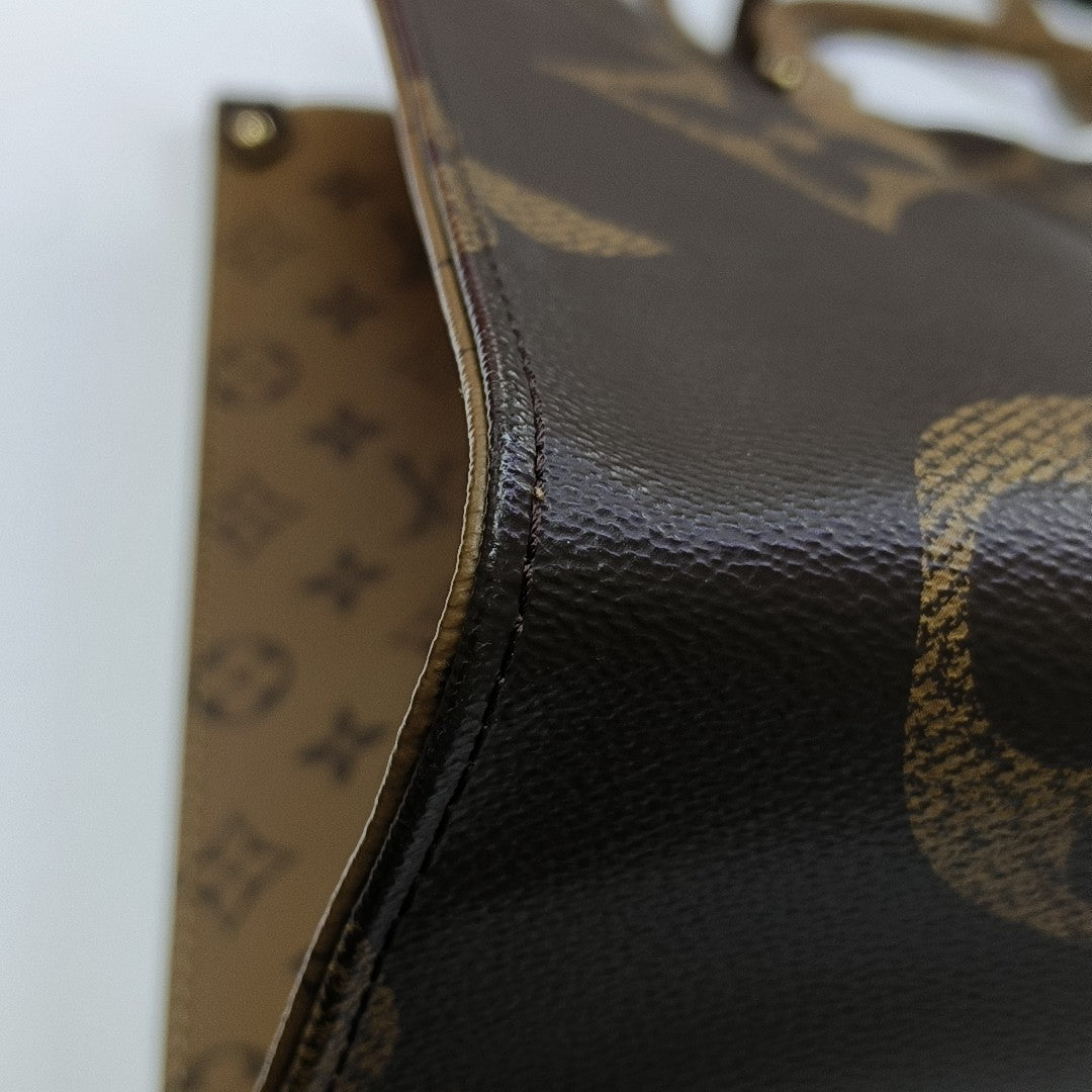 ONTHEGO GM Monogram Coated Canvas Brown