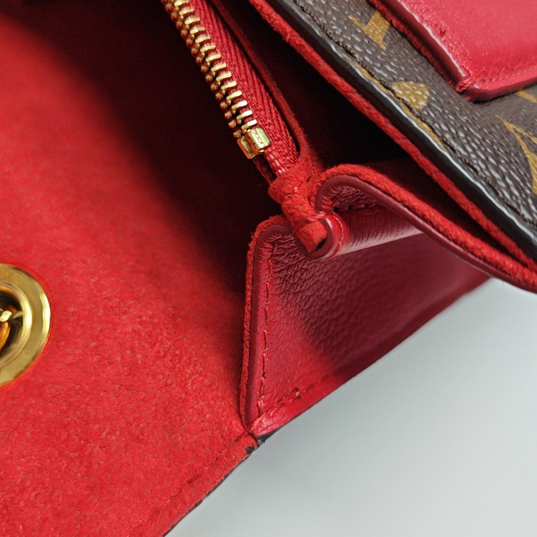 VICTOIRE Monogram Coated Canvas Brown