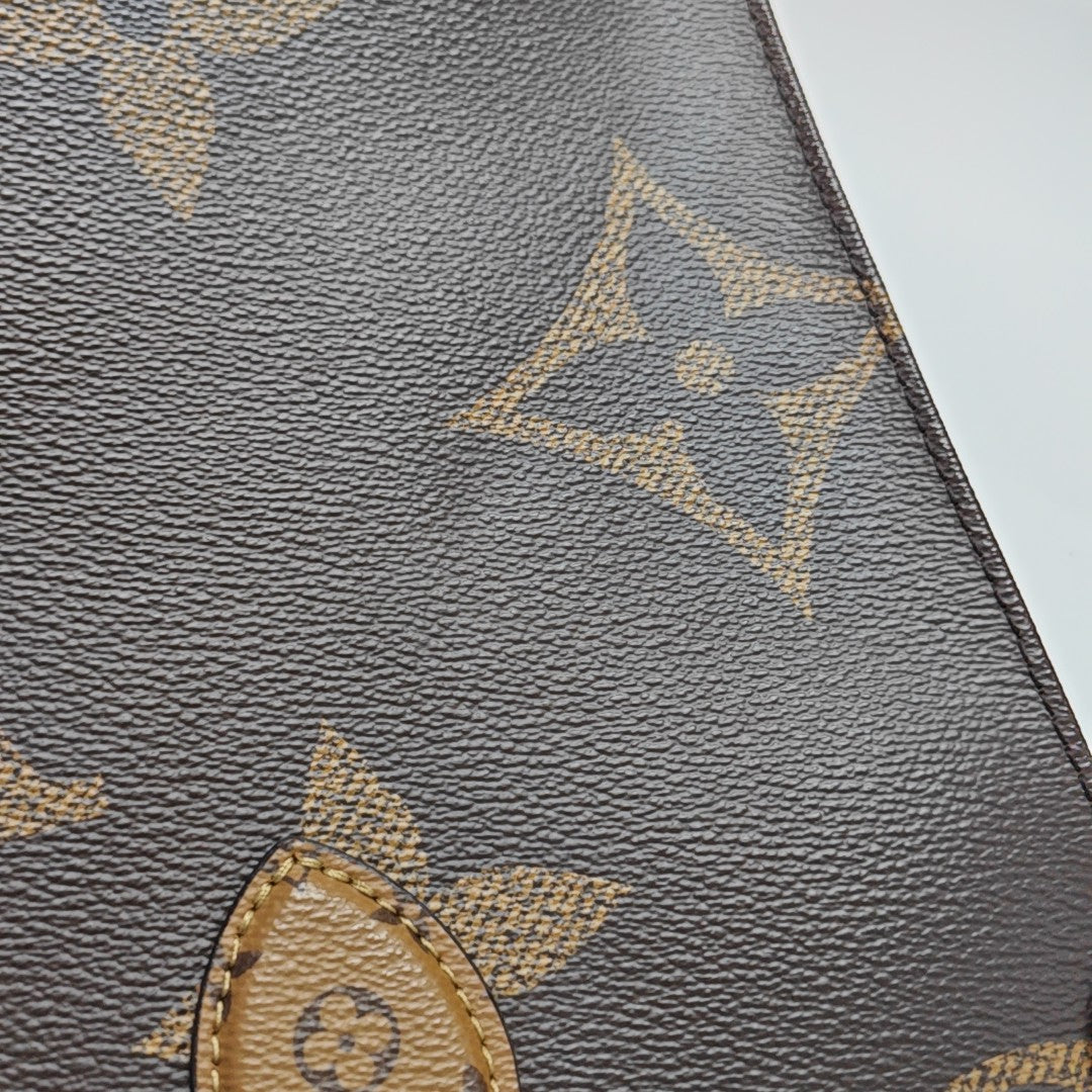 ONTHEGO MM Monogram Coated Canvas Brown