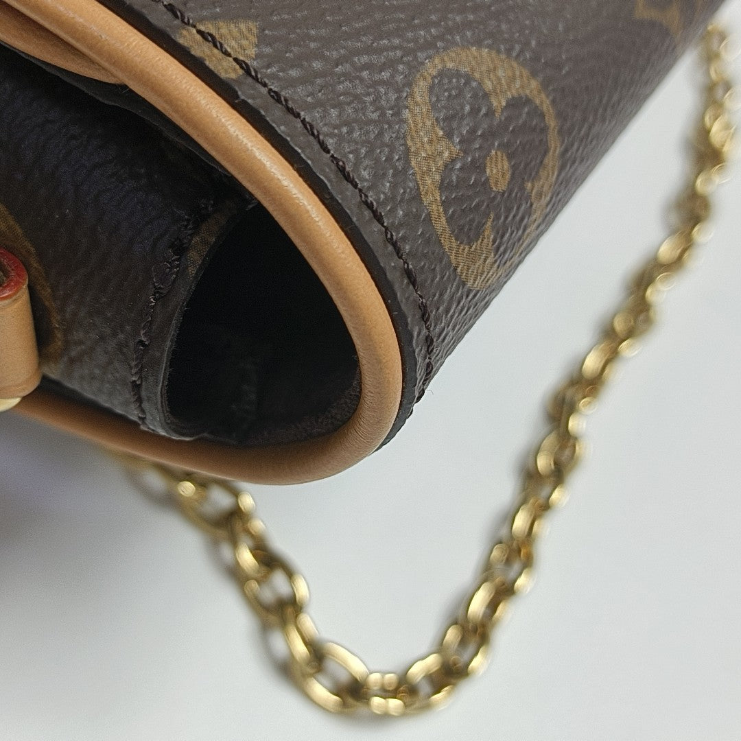 Pochette Camille Monogram Coated Canvas Brown
