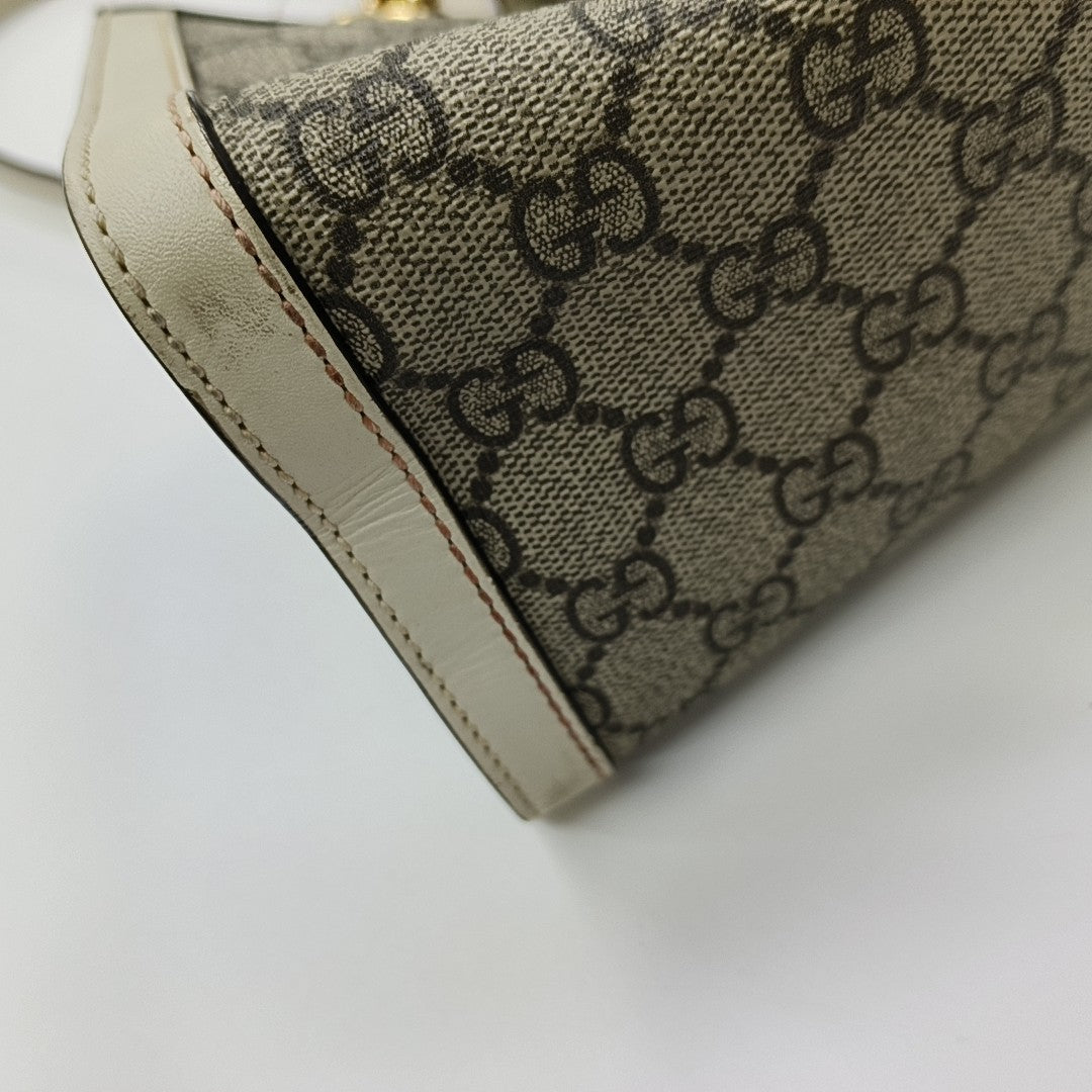 Padlock Small Monogram Coated Canvas Beige