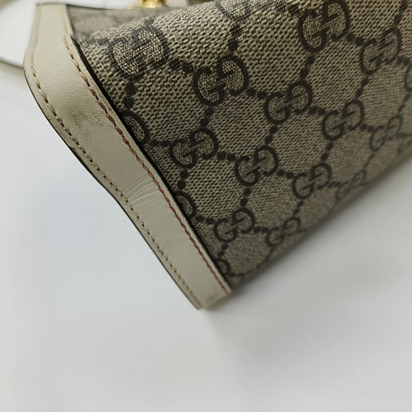 Padlock Small Monogram Coated Canvas Beige