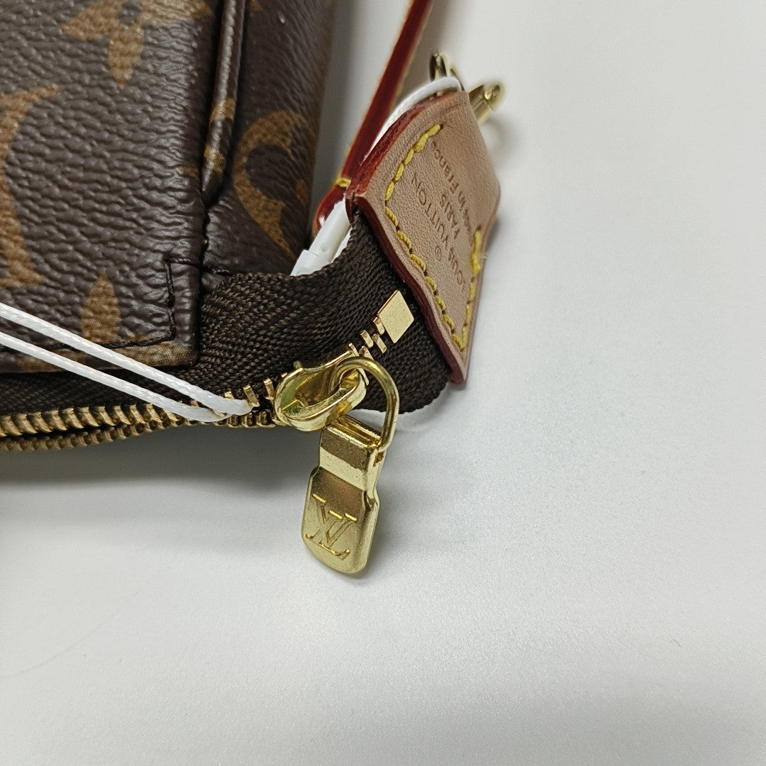 ACCESSOIRES GM Monogram Coated Canvas Brown