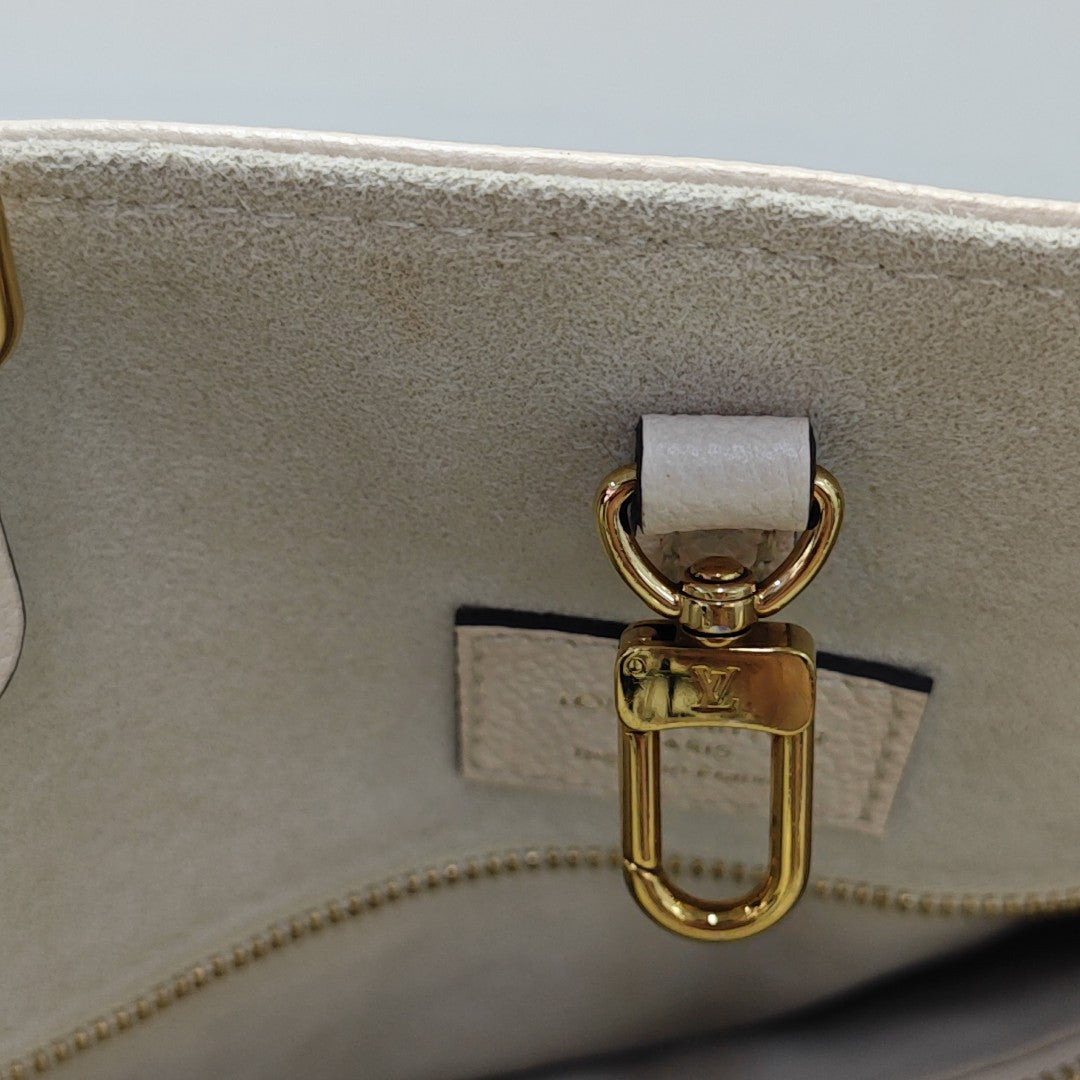 ONTHEGO MM Monogram Calfskin Beige
