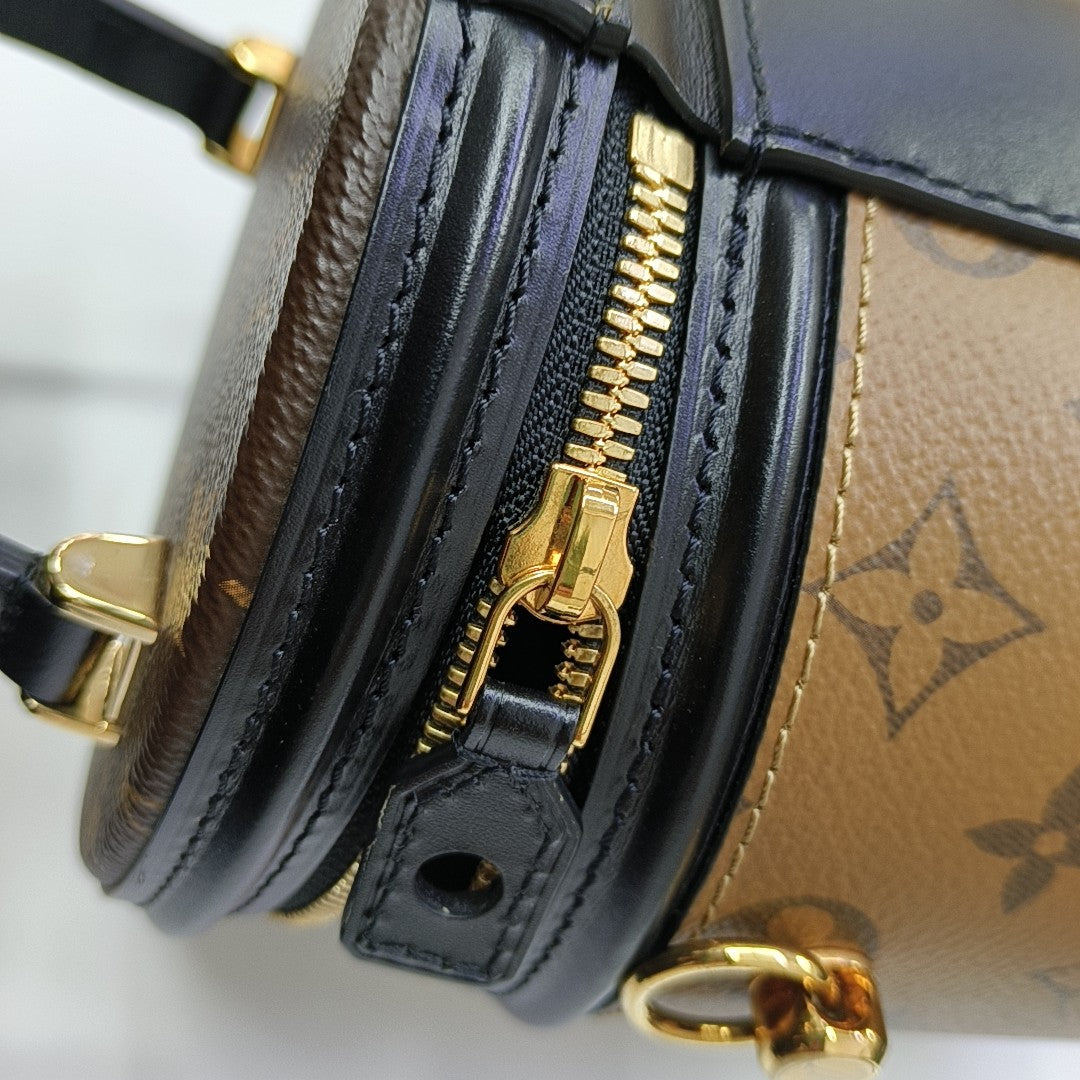 CANNES PM Monogram Coated Canvas Brown