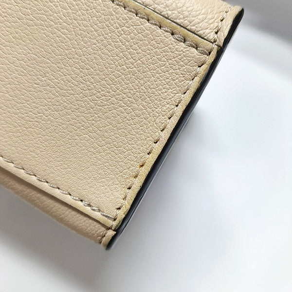 Authenticated pre-owned  LOCKME BB Calfskin Beige - Crossbody Bag at Looply