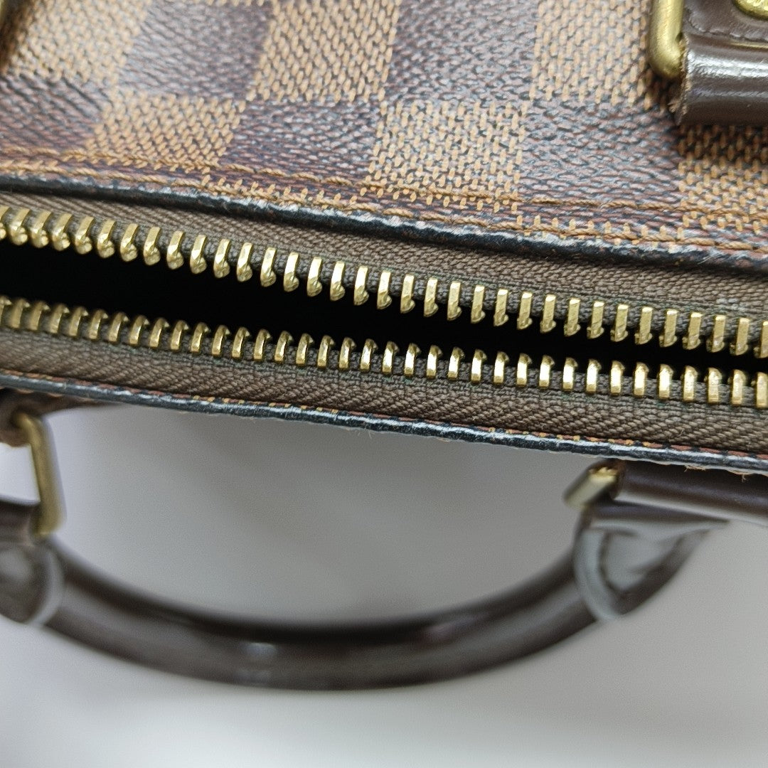 SPEEDY 25 Damier Ebene Coated Canvas Brown