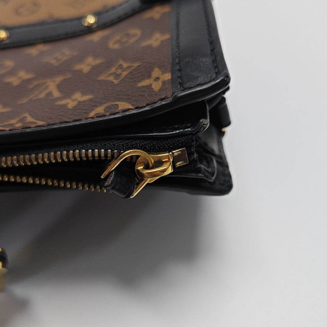 TRUNK Monogram Coated Canvas Brown