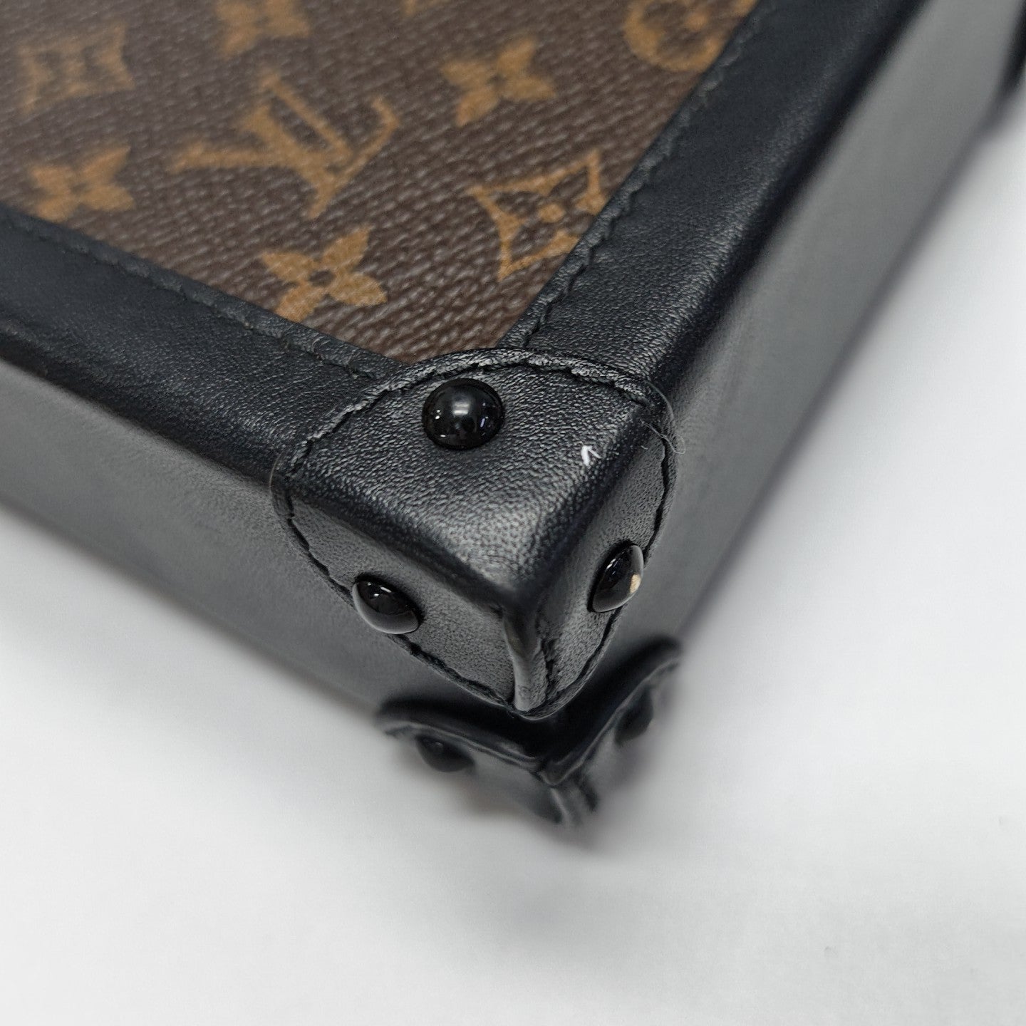 TRUNK Monogram Coated Canvas Brown